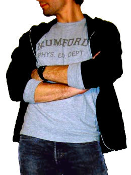 A photo of a costume of Axel Foley from the movie Beverly Hills Cop.  Axel is wearing a grey long sleeve t-shirt that says Mumford Phys Ed Dept, a black hoodie, and jeans.