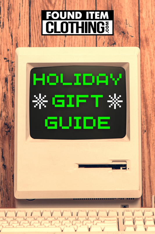 Vintage computer with words Holiday Gift Guide on screen