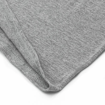 Close-up of gray fabric with a visible seam on a white background