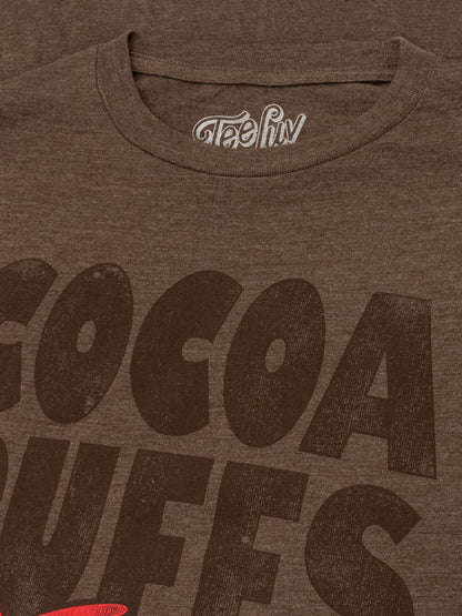 Brown t-shirt with 'Cocoa Dweels' text and a visible brand logo on a brown background