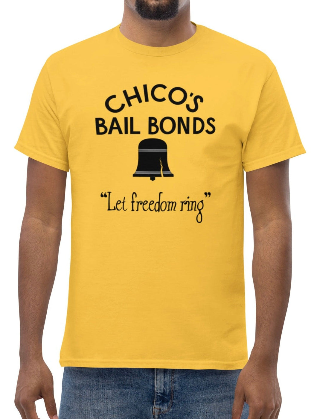 Man wearing a yellow t-shirt with 'Chico's Bail Bonds' text and graphic on a white background