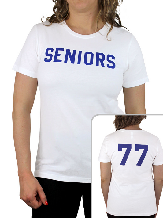 Woman wears white t-shirt that says "SENIORS" on the front in blue letters.  Bottom right corner of the image has an inset photo showing the back of the shirt.  The back shows the number 77. 