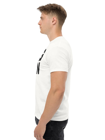 Man wearing a white t-shirt with black text on a white background