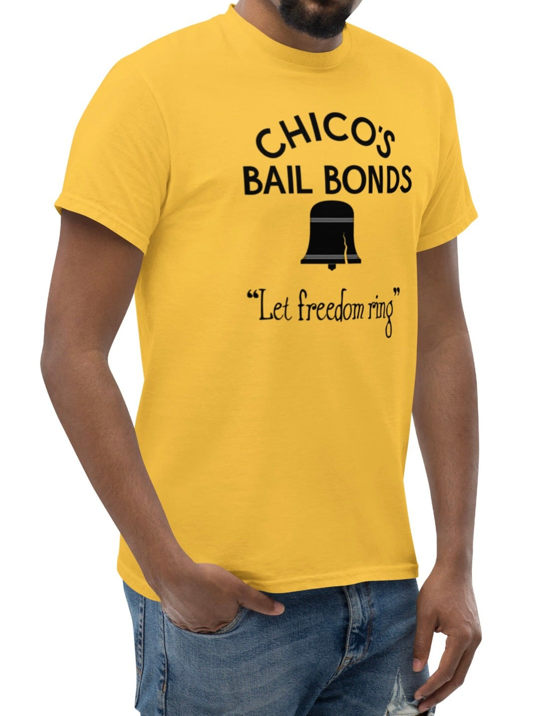 Man wearing a yellow t-shirt with 'Chico's Bail Bonds' text and graphic on a white background