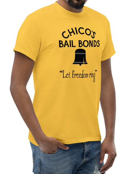 Man wearing a yellow t-shirt with 'Chico's Bail Bonds' text and graphic on a white background