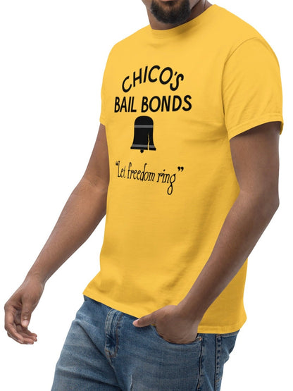 Man wearing a yellow t-shirt with 'Chico's Bail Bonds' text on a white background