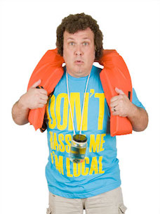 Costume guide for Bob Wiley from the movie What About Bob?  Bob is wearing a blue shirt that says "Don't Hassle Me I'm Local" in yellow lettering, and an orange life jacket.