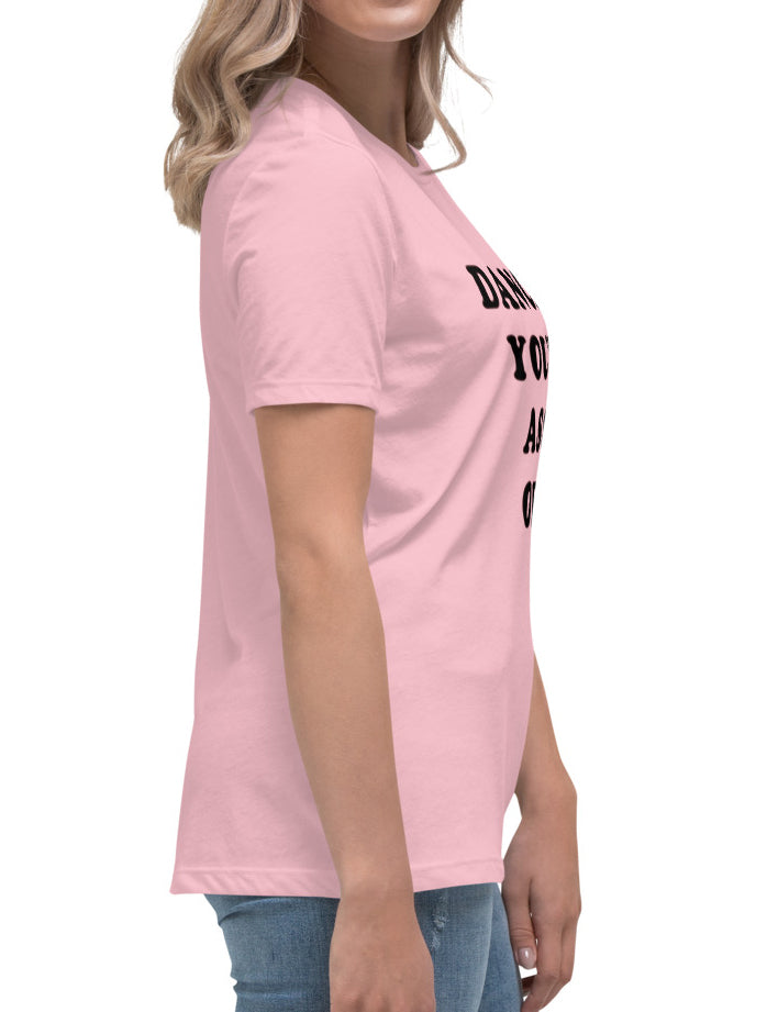 Person wearing a pink t-shirt with text on a white background