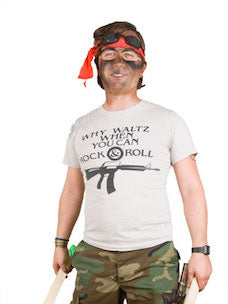 Costume guide for Edgar Frog from the movie Lost Boys.  Edgar wears a beige t-shirt that says "Why Waltz When You Can Rock & Roll," camoflage print pants, and a red bandanna tied on his head.  He has a dirty face and goggles.