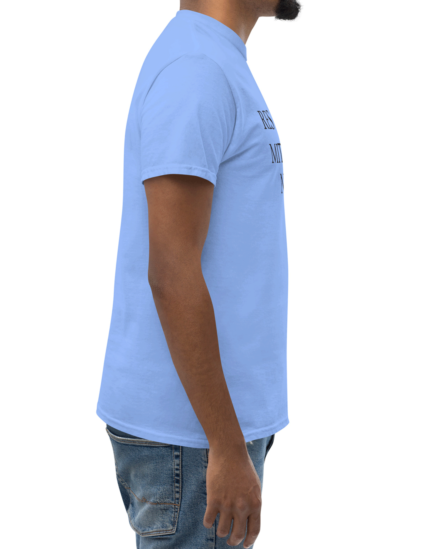 Person wearing a light blue t-shirt with text on the front, standing against a white background, seen in profile