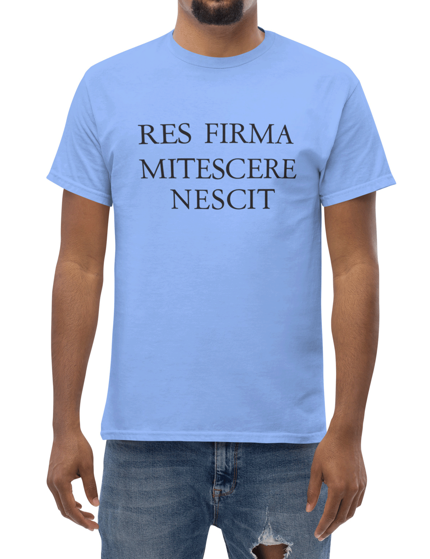 Person wearing a light blue t-shirt with Latin text on a white background