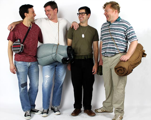 Costume guide for the four boys from the movie Stand by Me.  They wear jeans, and t-shirts and carry a canteens and sleeping bags.