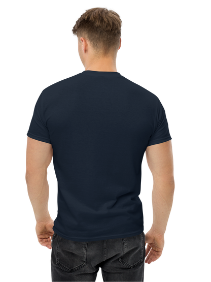 Man wearing a plain navy blue t-shirt on a white background