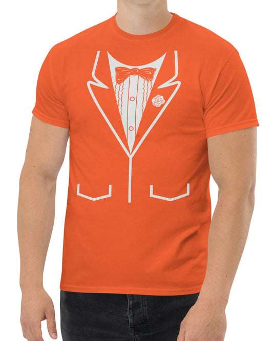 A man wearing a bright orange crewneck t-shirt with a white graphic print of a tuxedo jacket, shirt, bow tie, and pocket lines.