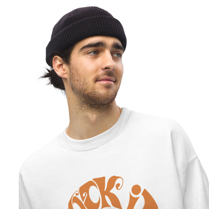 Man wearing a black beanie and white sweatshirt with orange design on a white background